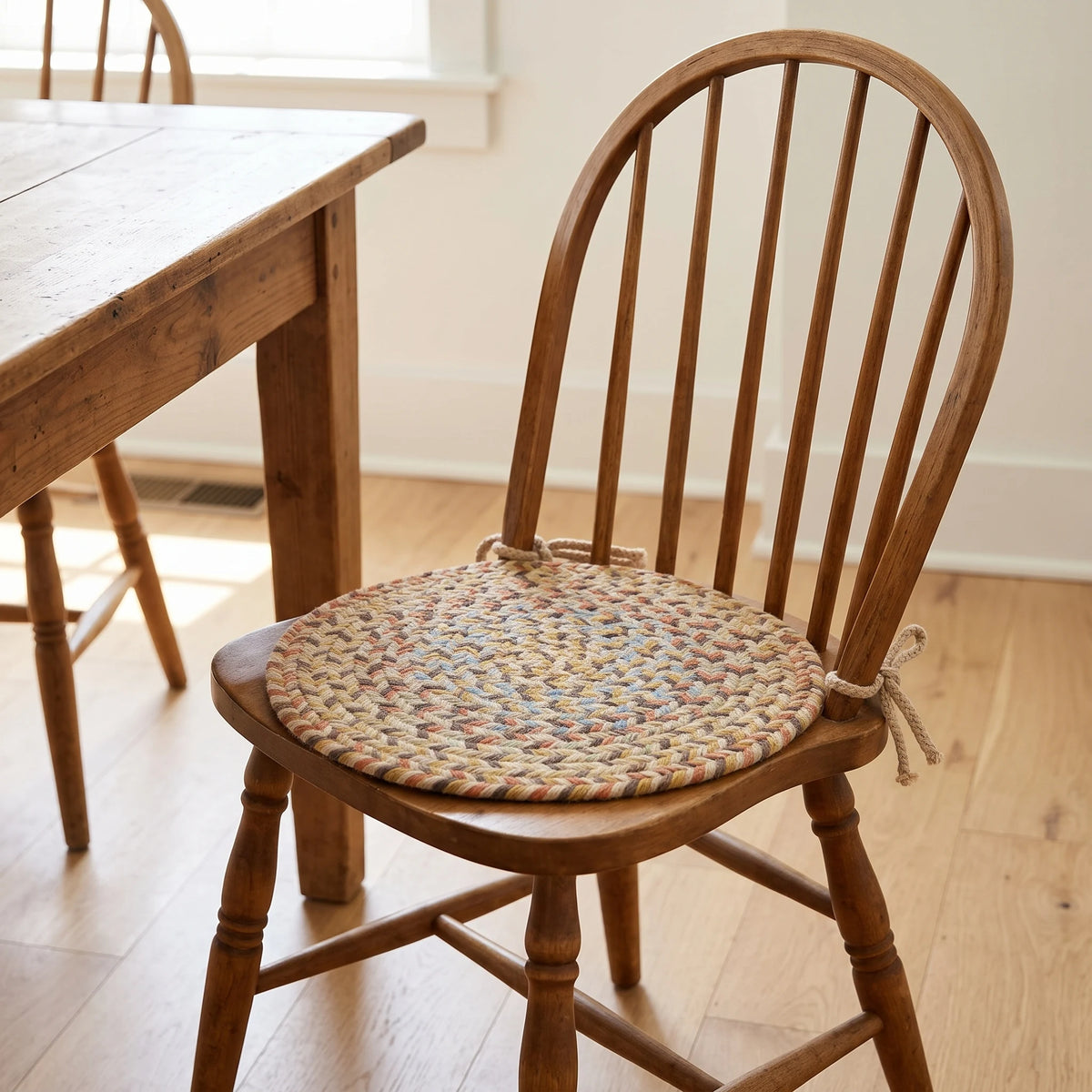 Confetti Braided Chair Pad - Earth Beige - tied on a wooden Windsor dining chair