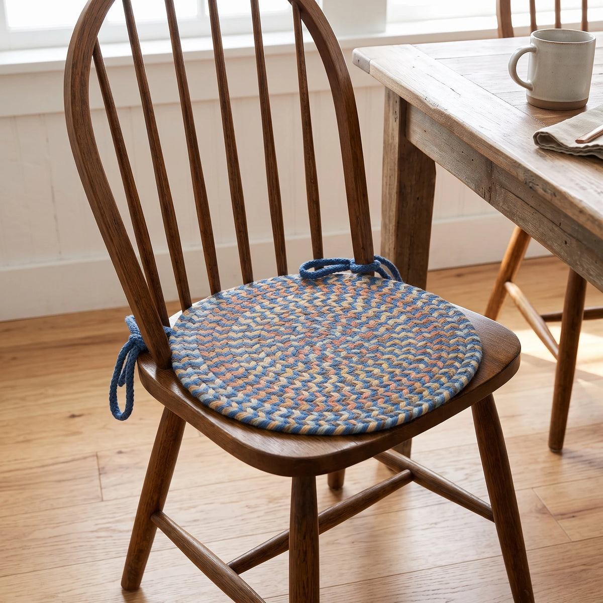 Confetti Braided Chair Pad - Marina Blue - tied on a wooden Windsor dining chair