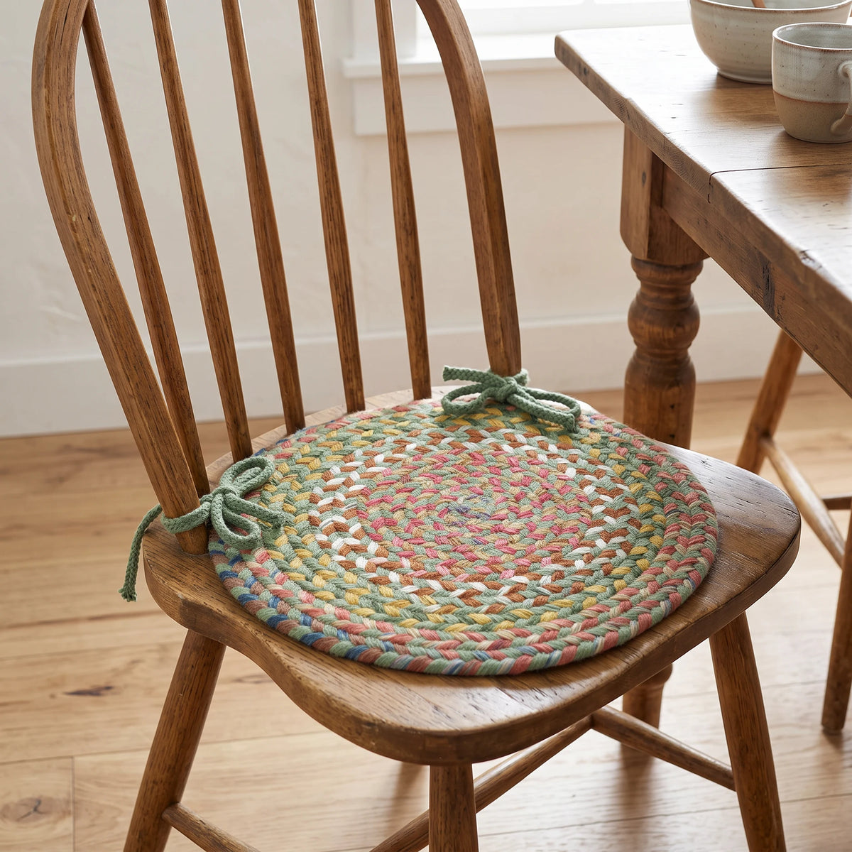 Gemstone Braided Chair Pad - Peridot - tied on a wooden Windsor dining chair