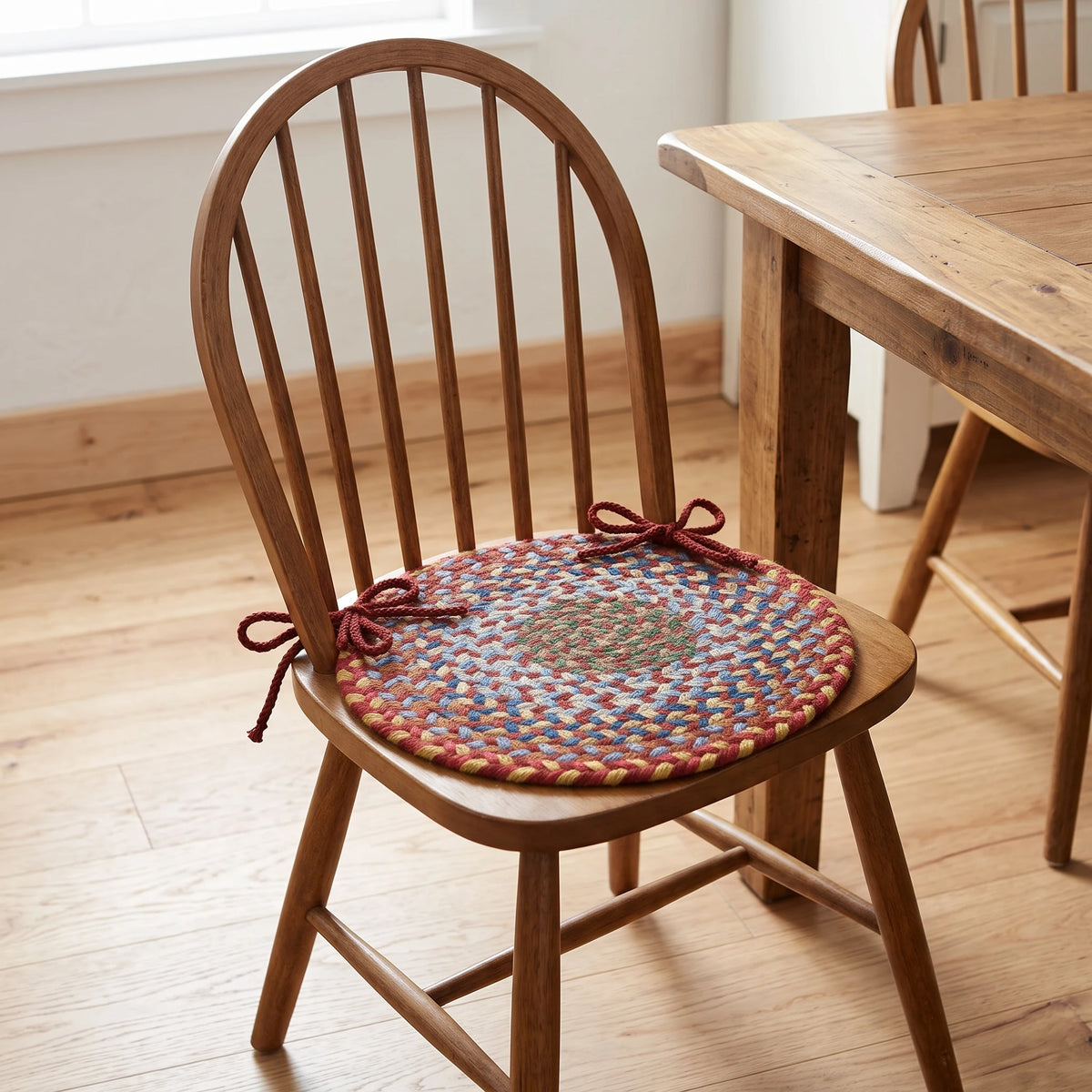 Gemstone Braided Chair Pad - Tawny Port - tied on a wooden Windsor dining chair