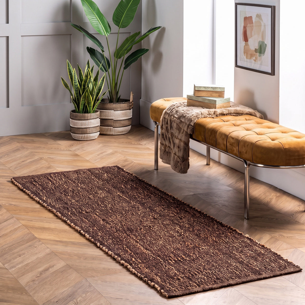Terra brown jute and cotton runner rug, 2' x 6', beside a bench
