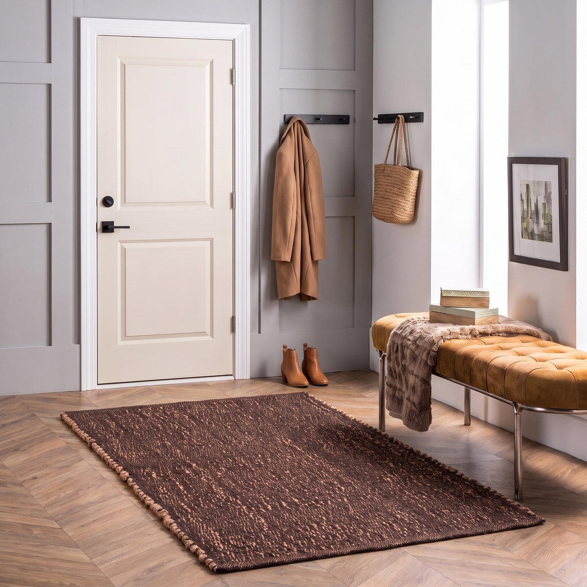 Terra brown jute and cotton rug, 3' x 5', in an entryway
