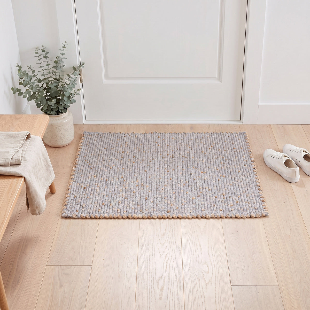 Terra light gray jute and cotton rug, 2' x 3', at a front door