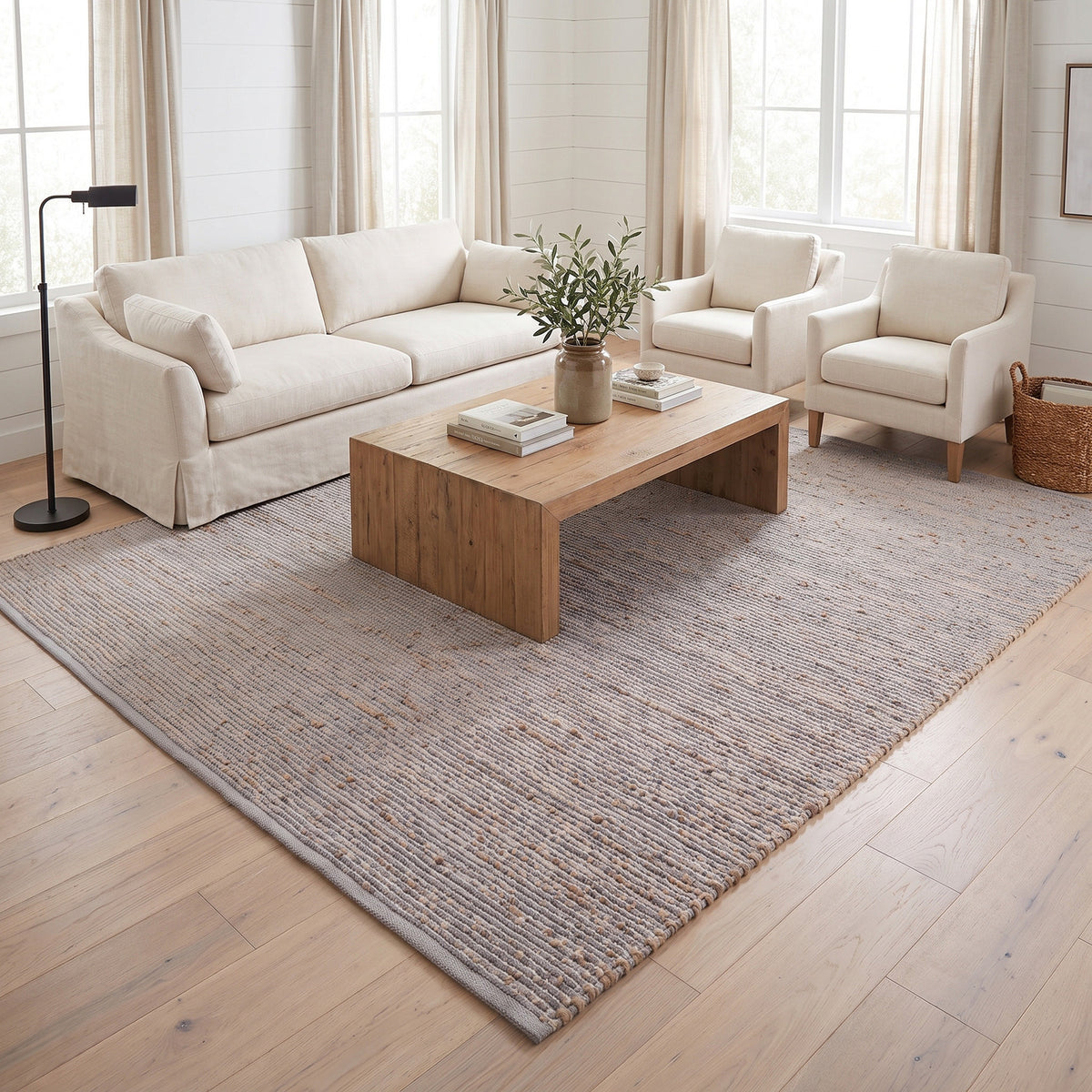 Terra light gray jute and cotton rug, 8' x 10', in a living room