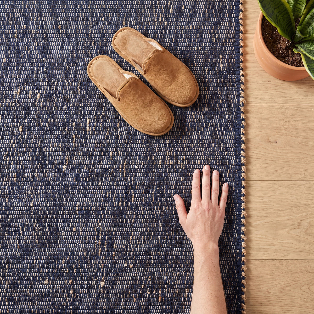 Terra navy jute and cotton rug close-up showing the jute-flecked weave