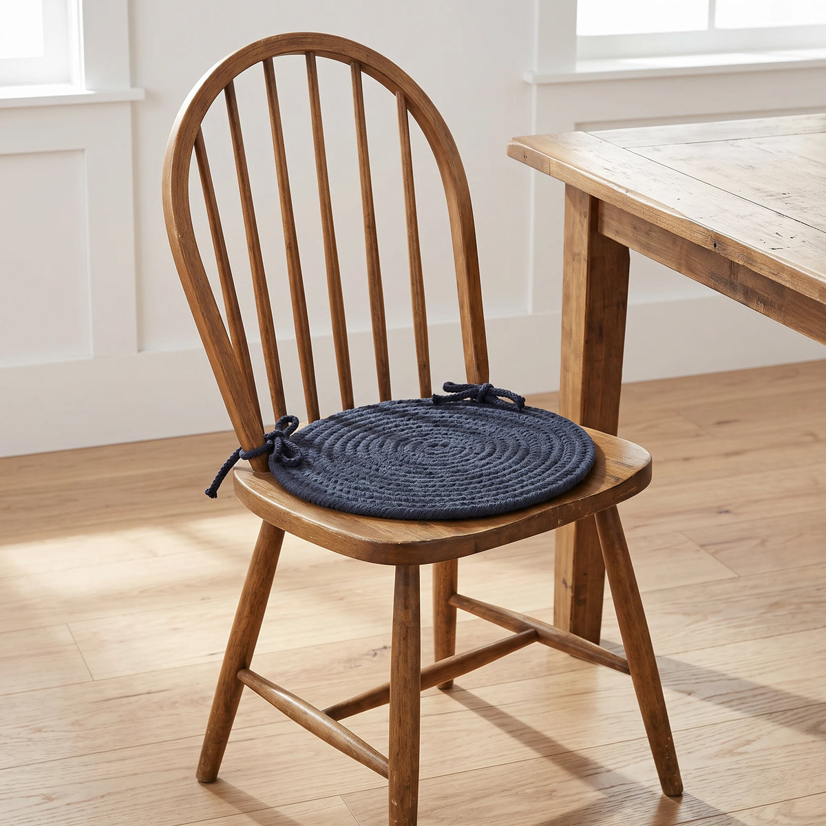 Maui Braided Chair Pad - Navy Blue - tied on a wooden Windsor dining chair