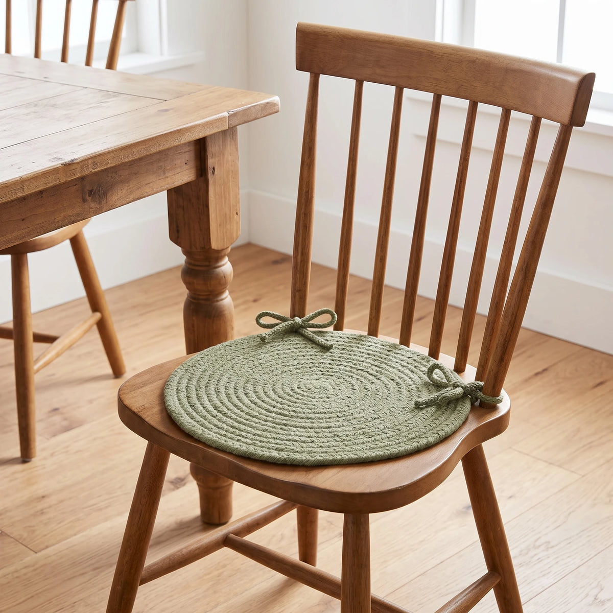 Maui Braided Chair Pad - Olive Green - tied on a wooden Windsor dining chair