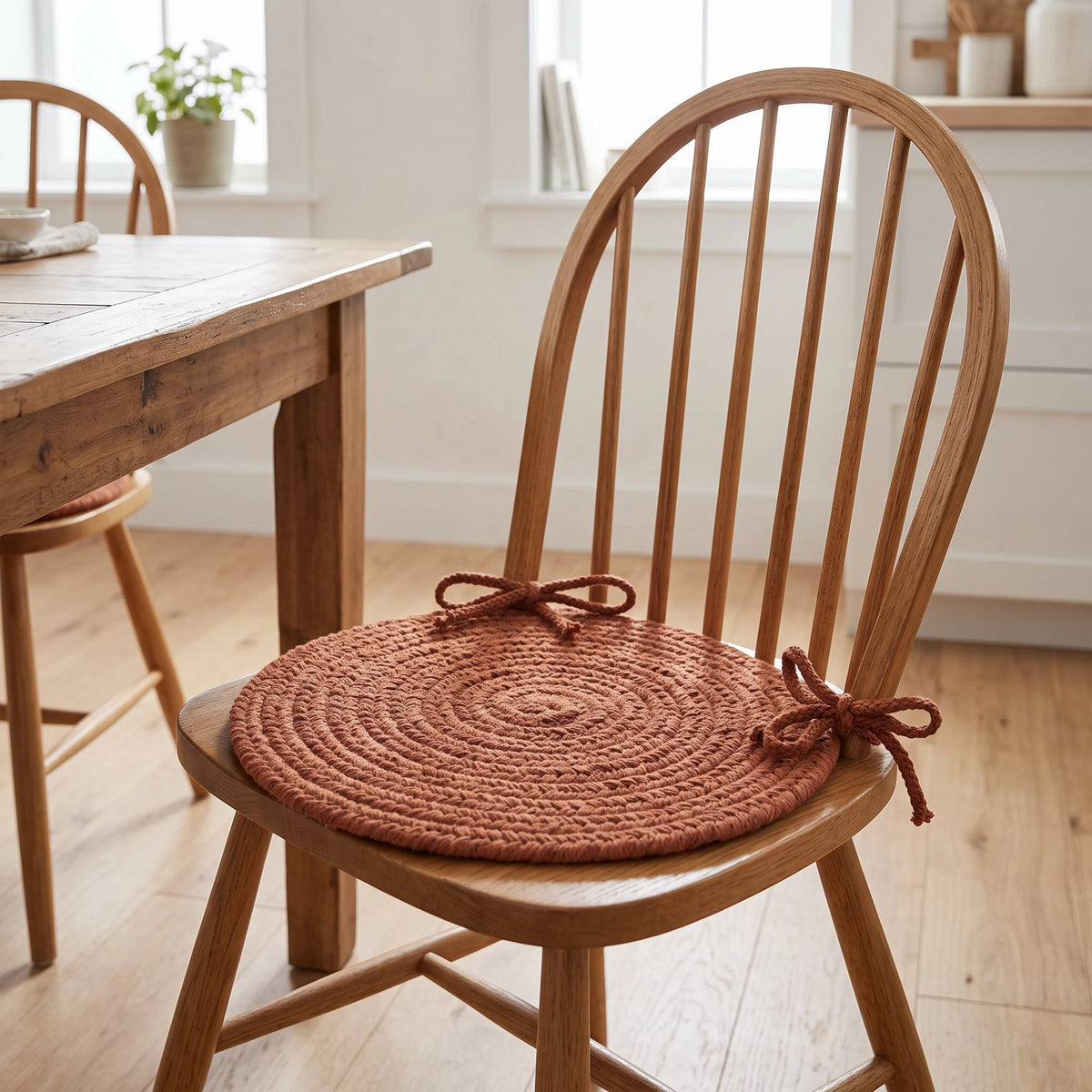 Maui Braided Chair Pad - Almond - tied on a wooden Windsor dining chair