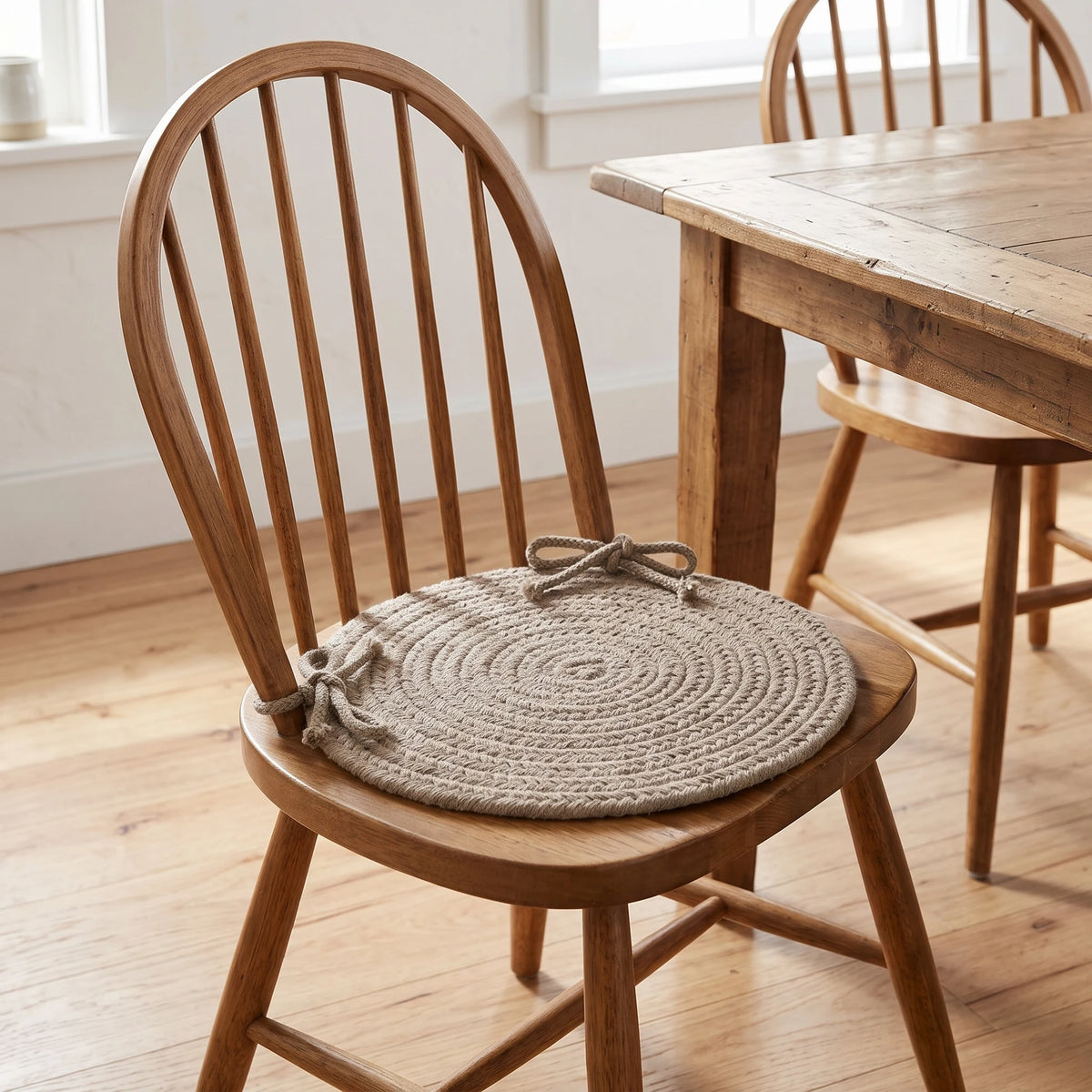 Maui Braided Chair Pad - Moss Green - tied on a wooden Windsor dining chair