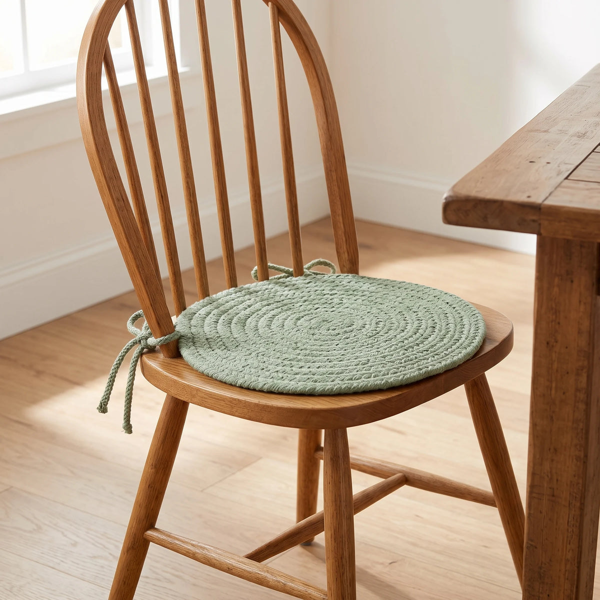Maui Braided Chair Pad - Celadon Green - tied on a wooden Windsor dining chair