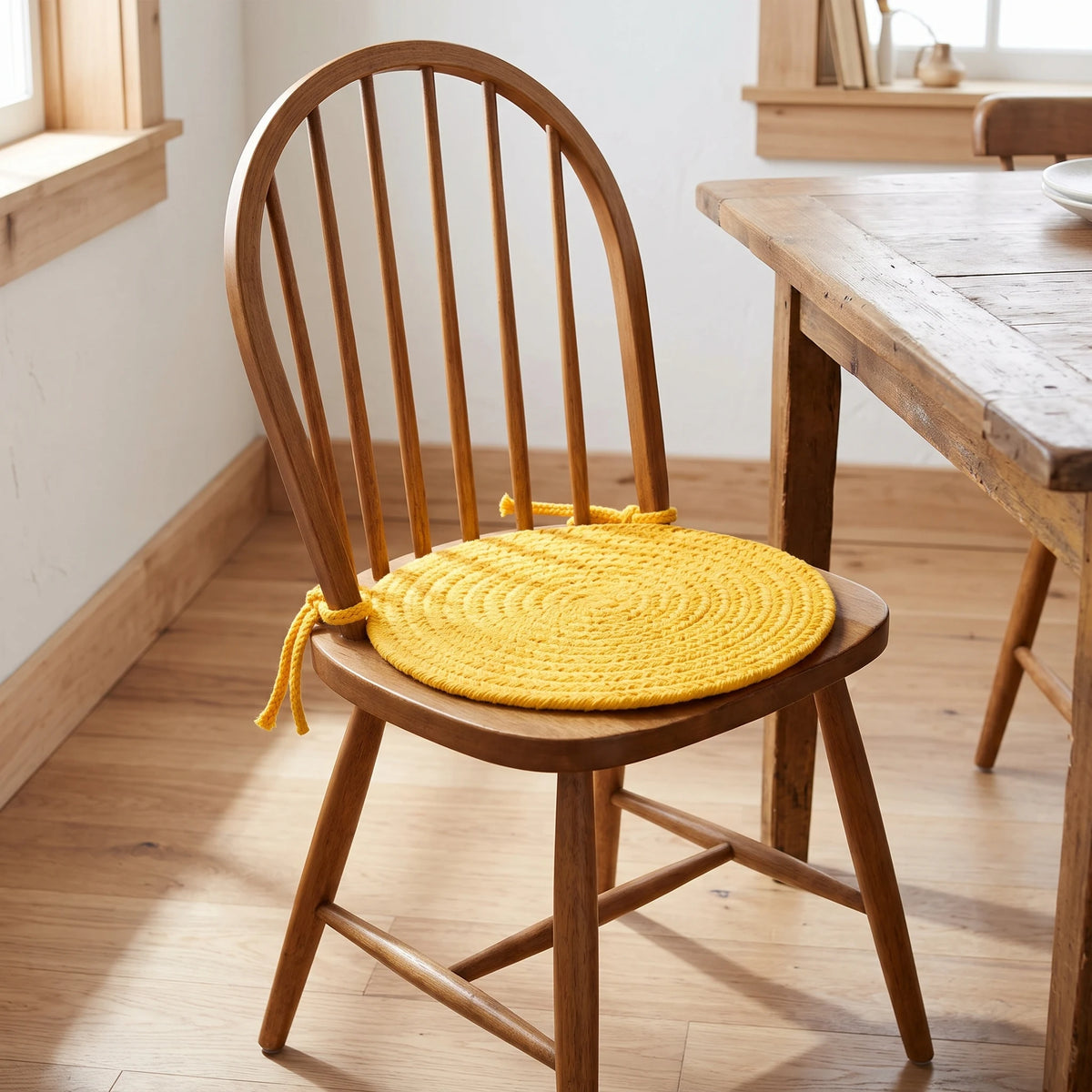 Maui Braided Chair Pad - Daffodil Yellow - tied on a wooden Windsor dining chair