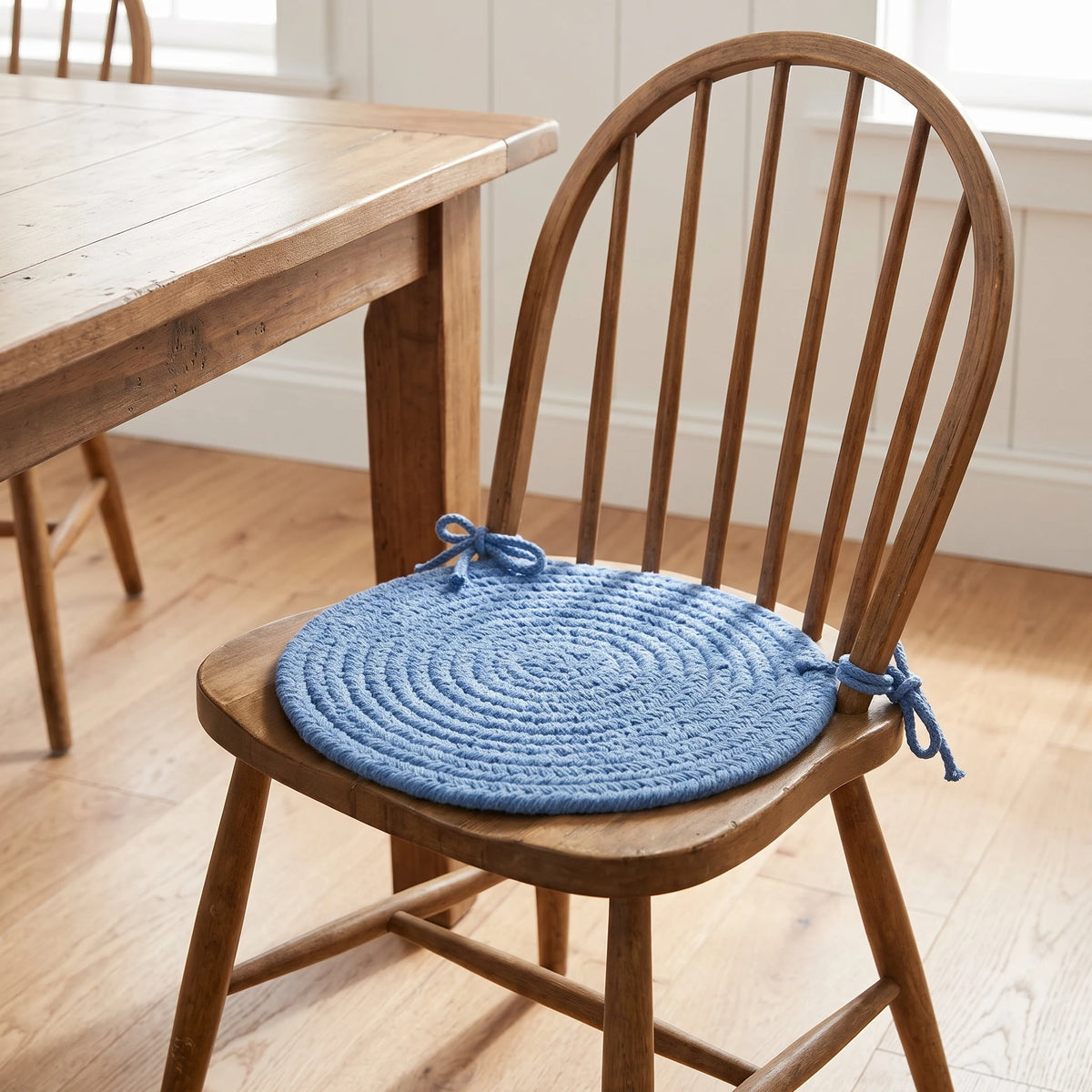 Maui Braided Chair Pad - French Blue - tied on a wooden Windsor dining chair