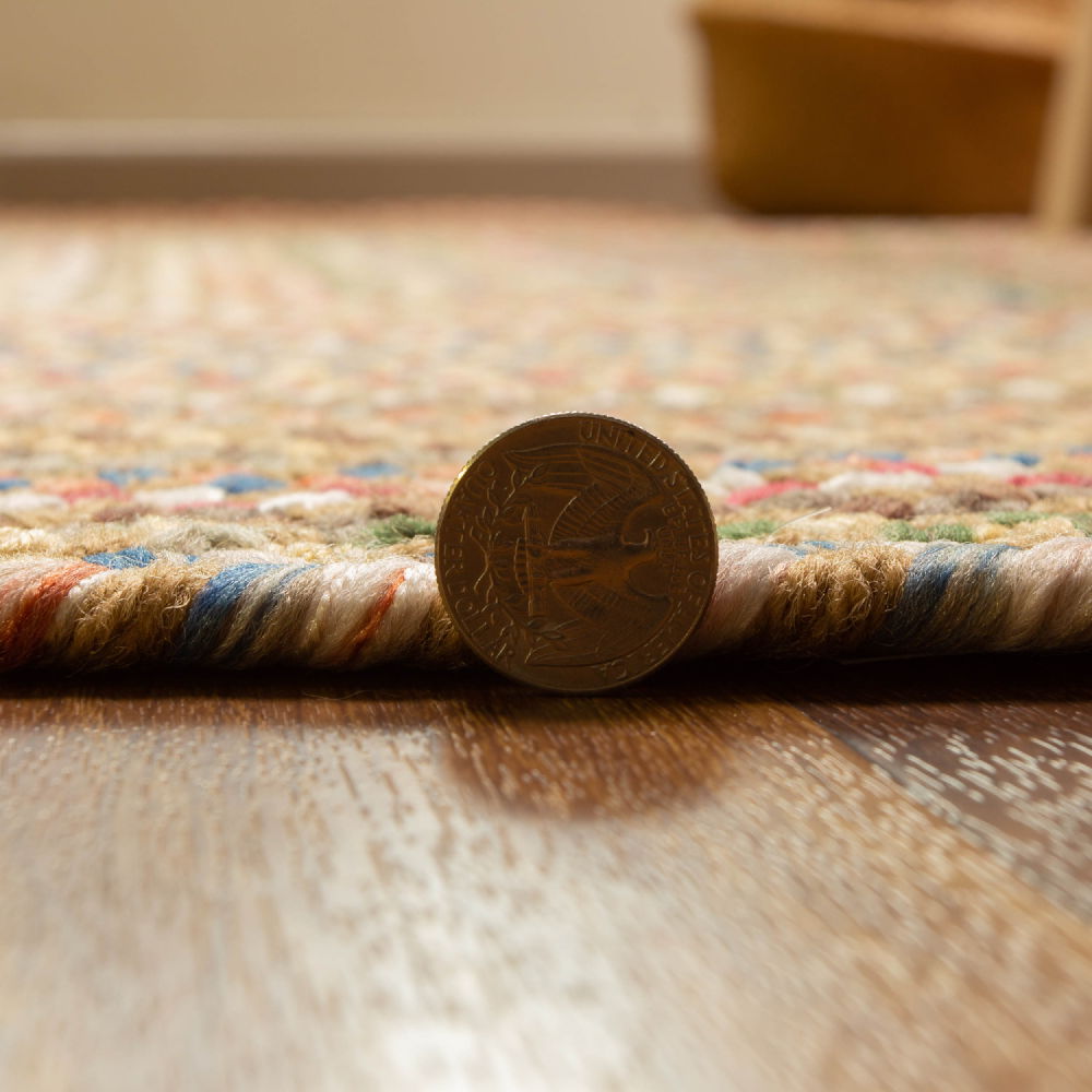 Roxbury Straw Beige braided rug, close up of the braided edge