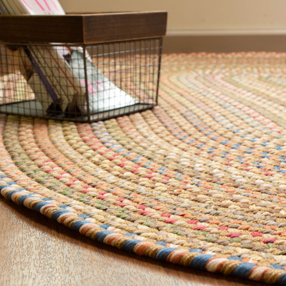 Roxbury Straw Beige braided rug styled in a room setting