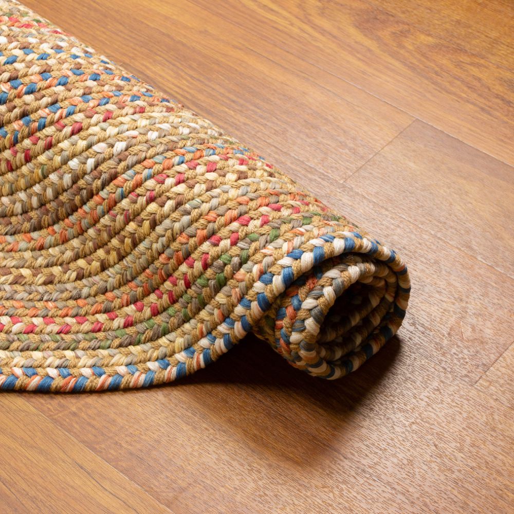 Roxbury Straw Beige braided rug rolled to show the braid construction