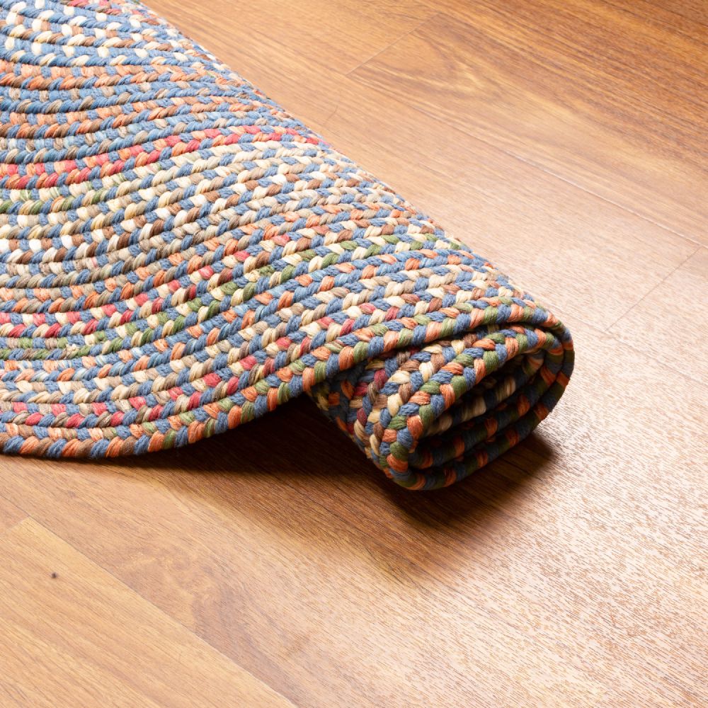 Roxbury Blue braided rug rolled to show the braid construction