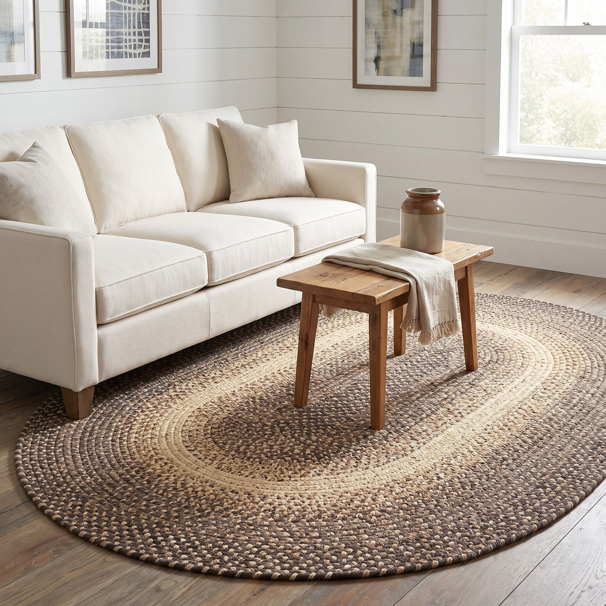 Ridgewood brown braided wool rug, 5x8 oval in a farmhouse sitting room under a linen sofa #Shape_Oval