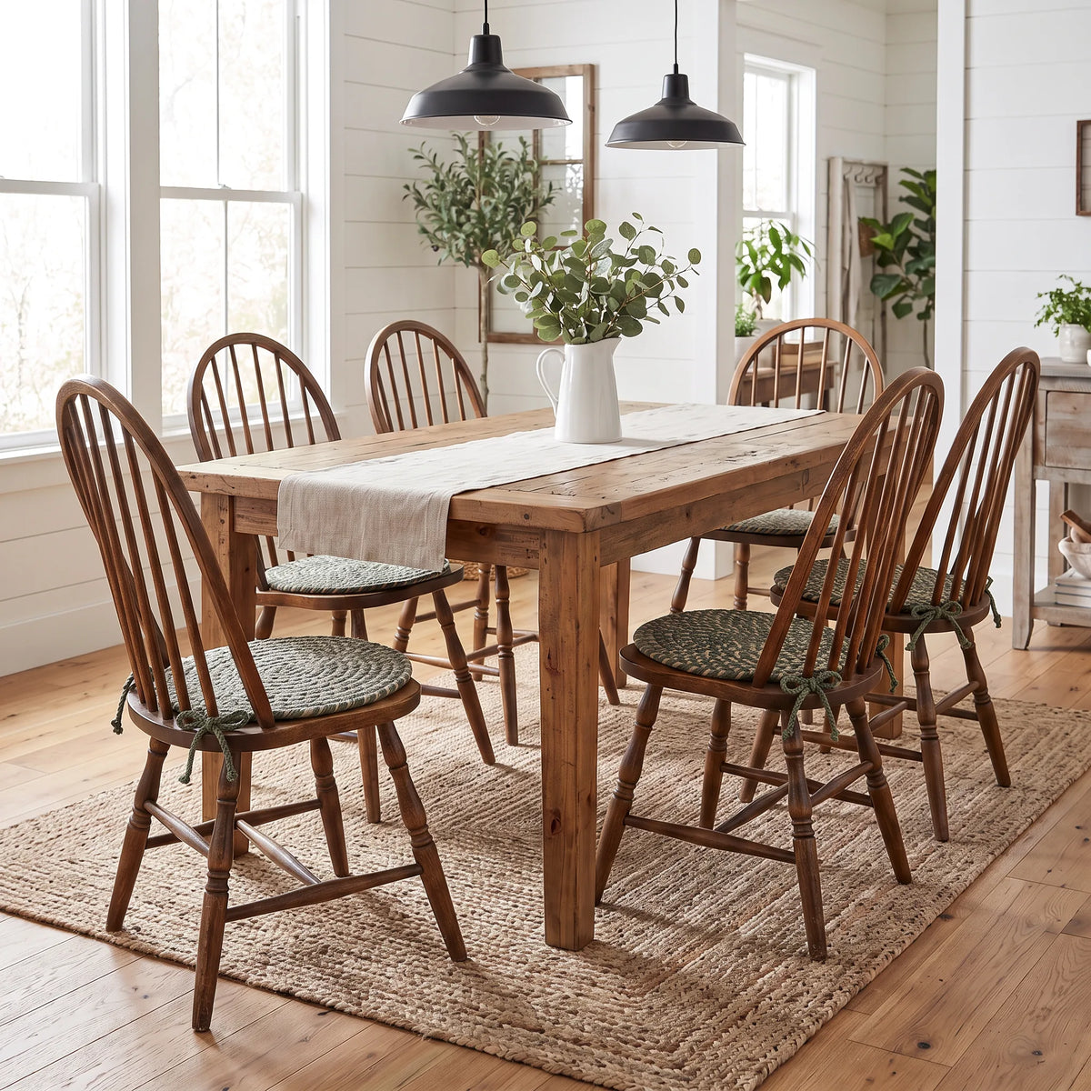 Ridgewood Braided Chair Pads - Forest Green - on six Windsor chairs at a modern farmhouse dining table