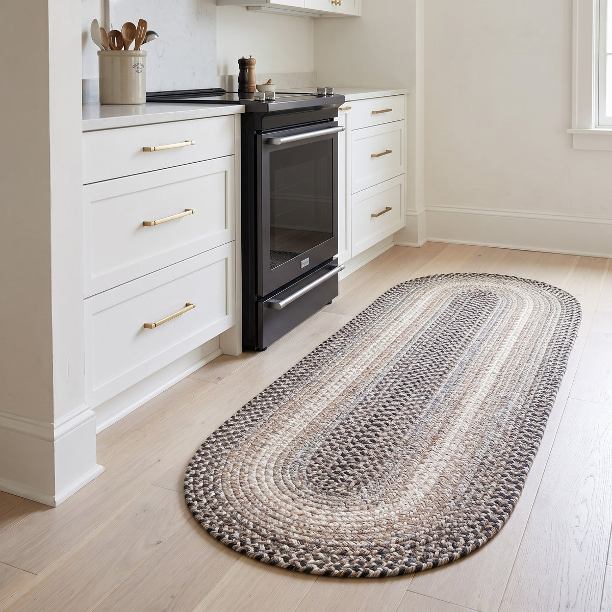 Ridgewood gray braided wool oval runner, 2x4 beside a kitchen range #Size_2' x 4' Runner