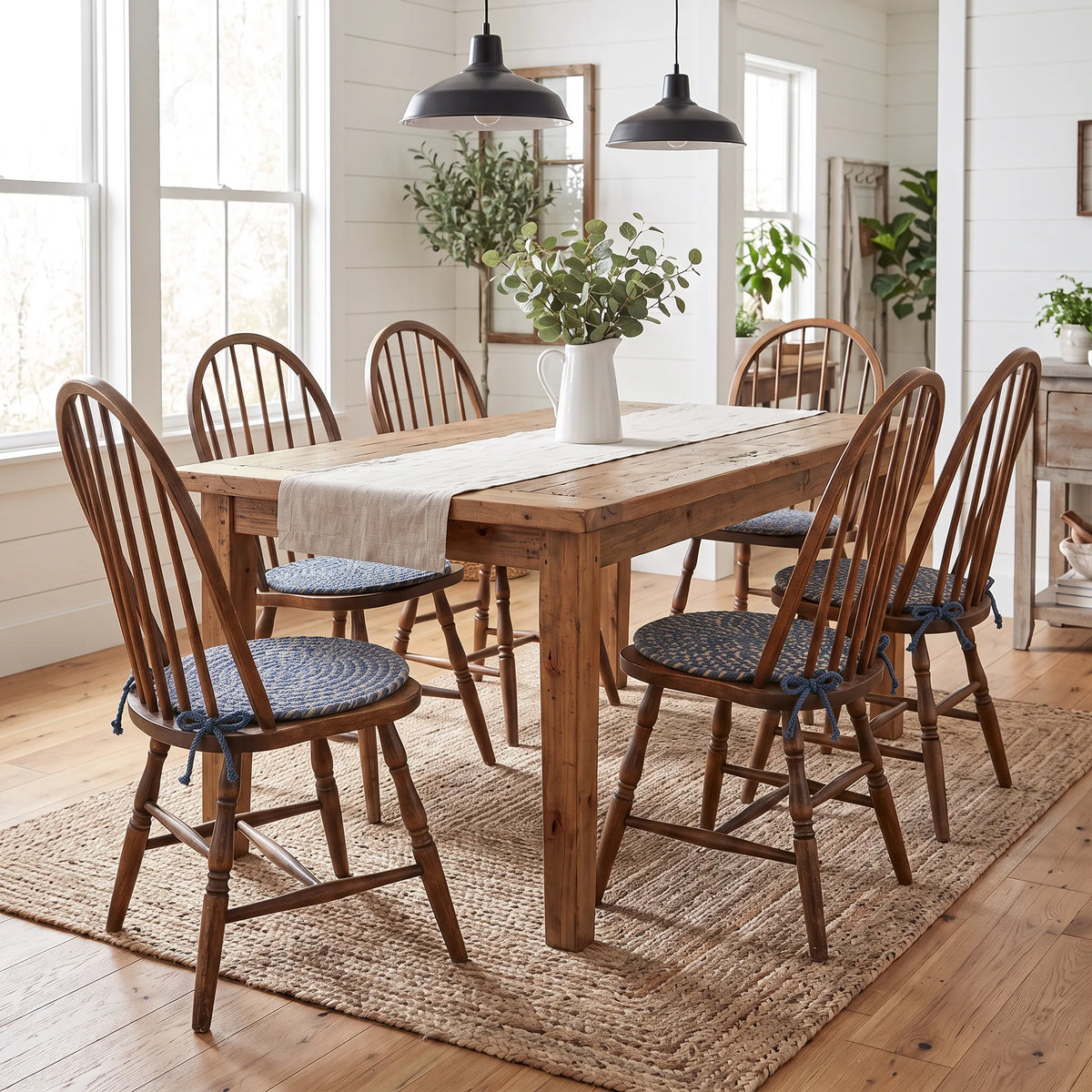Ridgewood Braided Chair Pads - Blue - on six Windsor chairs at a modern farmhouse dining table