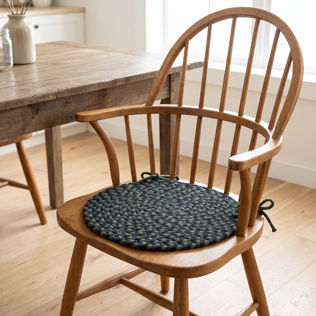 Santa Maria Braided Chair Pad - Verdant - tied on a wooden Windsor dining chair