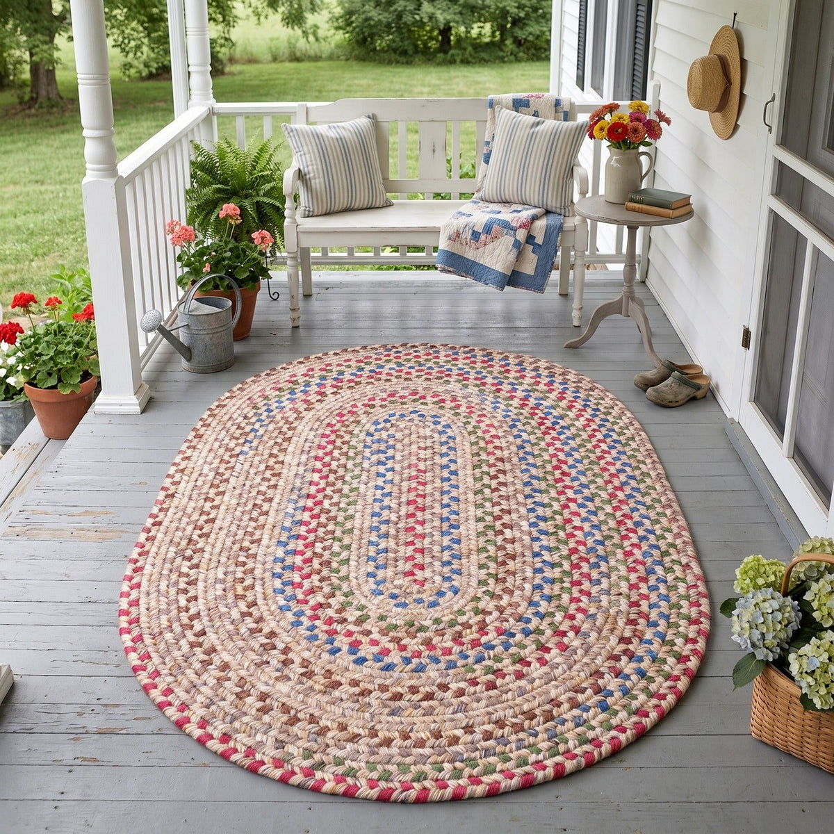 Sandy Beige Portsmouth braided rug, 4x6 oval, on a covered front porch #Size_4' x 6' Oval
