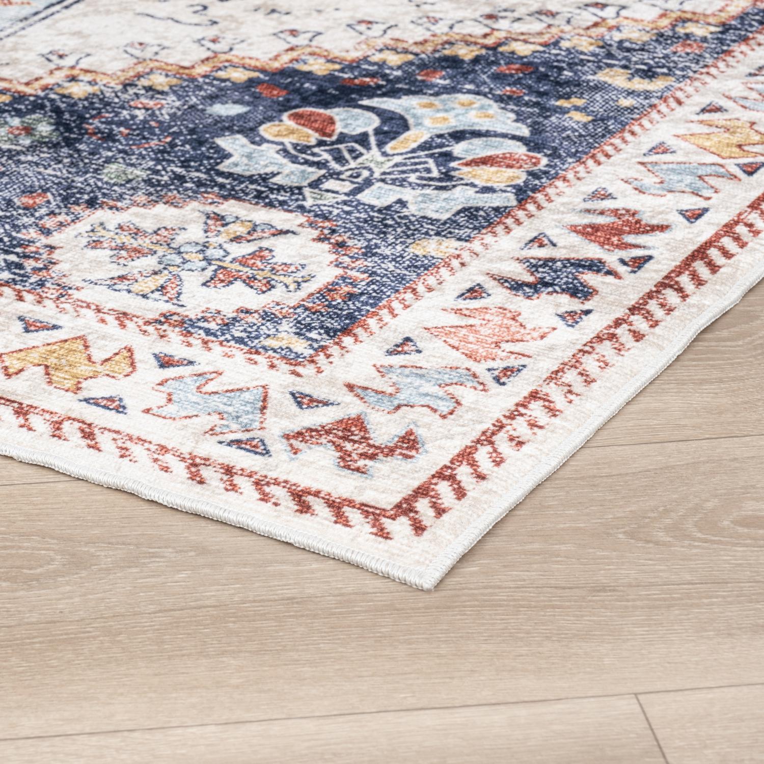 Pastel Bursa machine washable area rug 3' x 5' - corner detail on hardwood floor