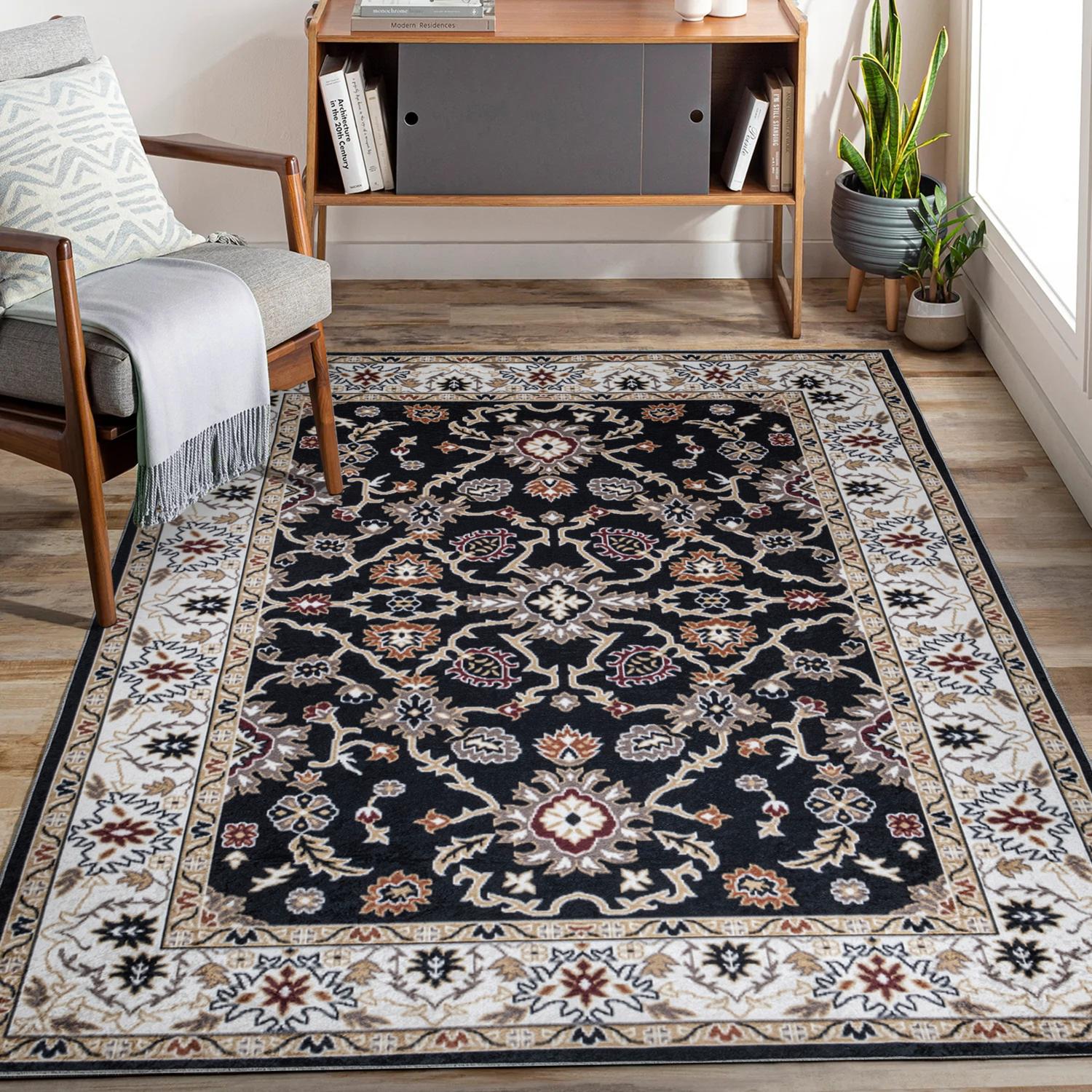 Black Bursa machine washable area rug 5' x 7' - styled in a living room