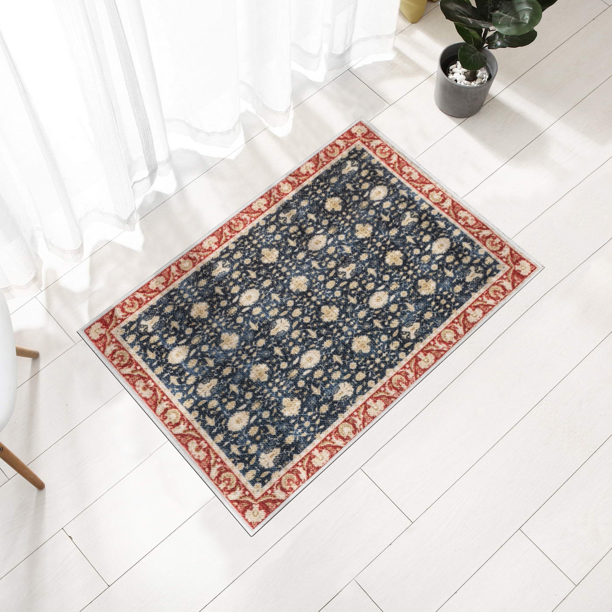 Navy Konya machine washable area rug 2' x 3' - styled in a room