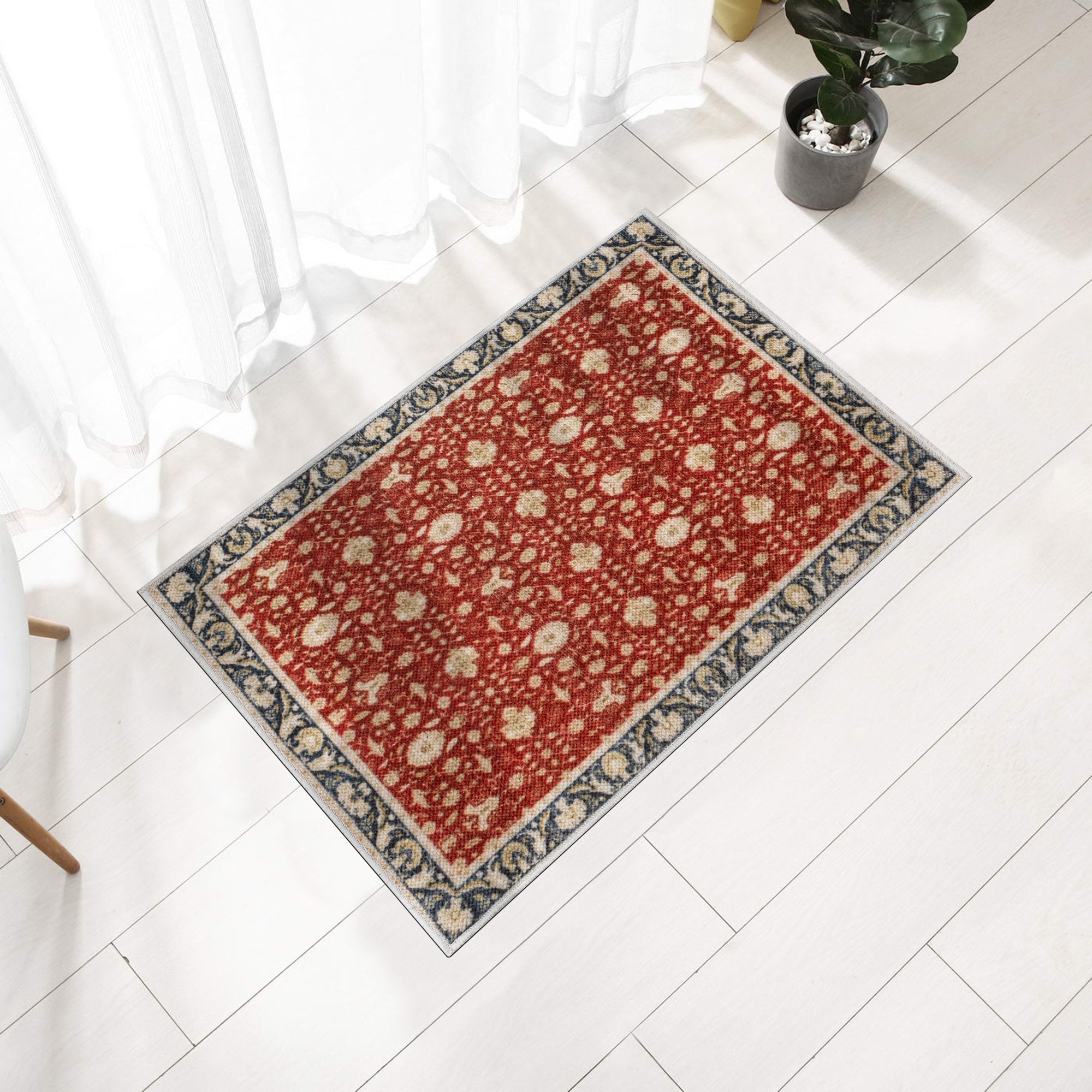 Red Konya machine washable area rug 2' x 3' - styled in a room