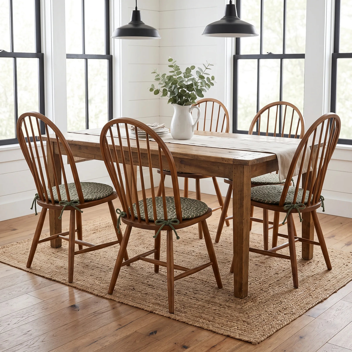 Ridgewood Braided Chair Pads on four Windsor chairs at a modern farmhouse dining table
