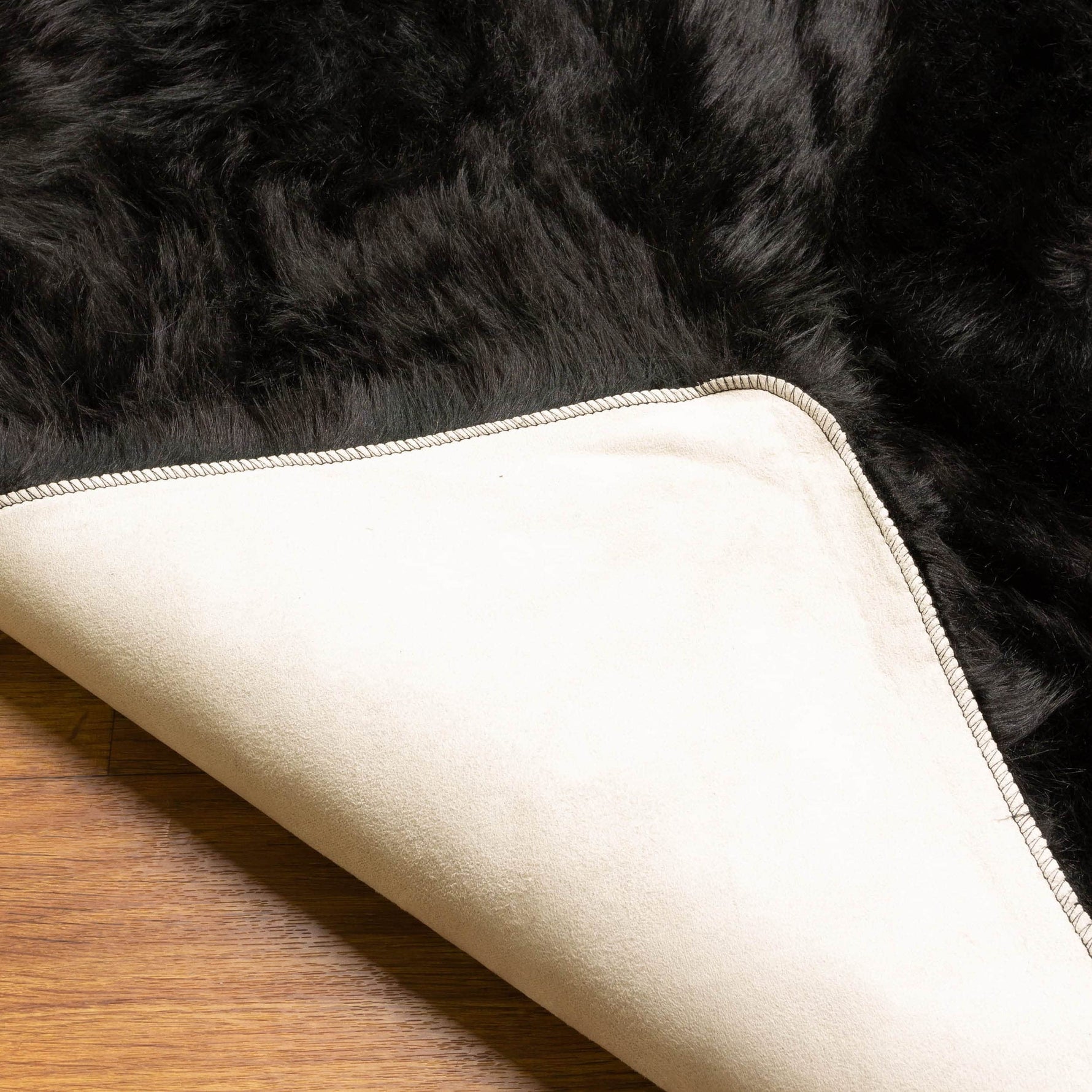 Black Serene Faux Fur Solid Fake Sheepskin Rug