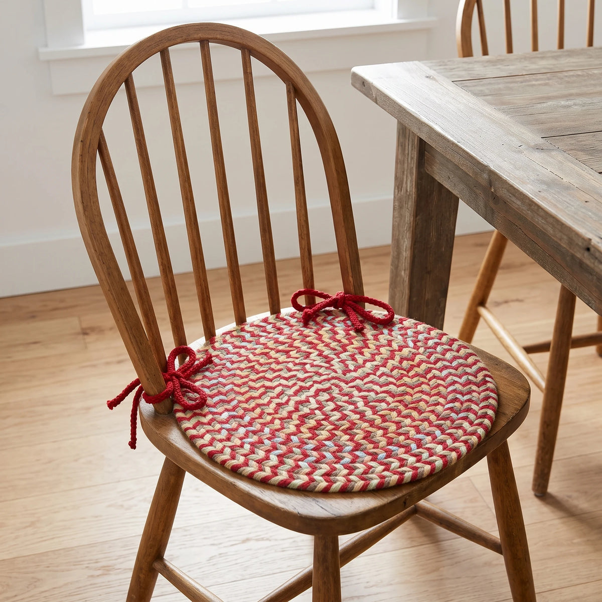 Confetti Braided Chair Pad - Brilliant Red - tied on a wooden Windsor dining chair