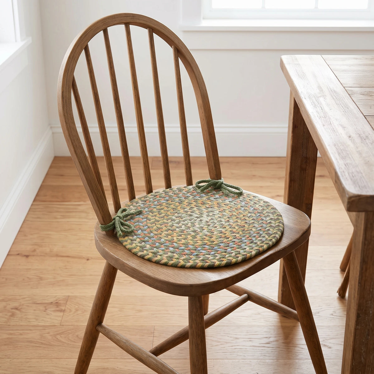 Confetti Braided Chair Pad - Olive - tied on a wooden Windsor dining chair