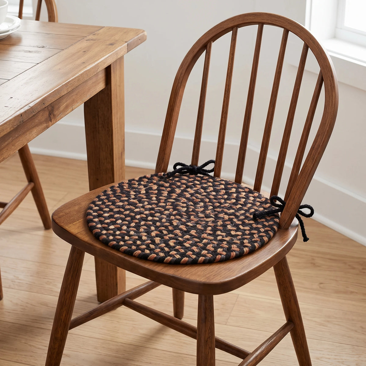 Hartford Braided Chair Pad - Charcoal - tied on a wooden Windsor dining chair
