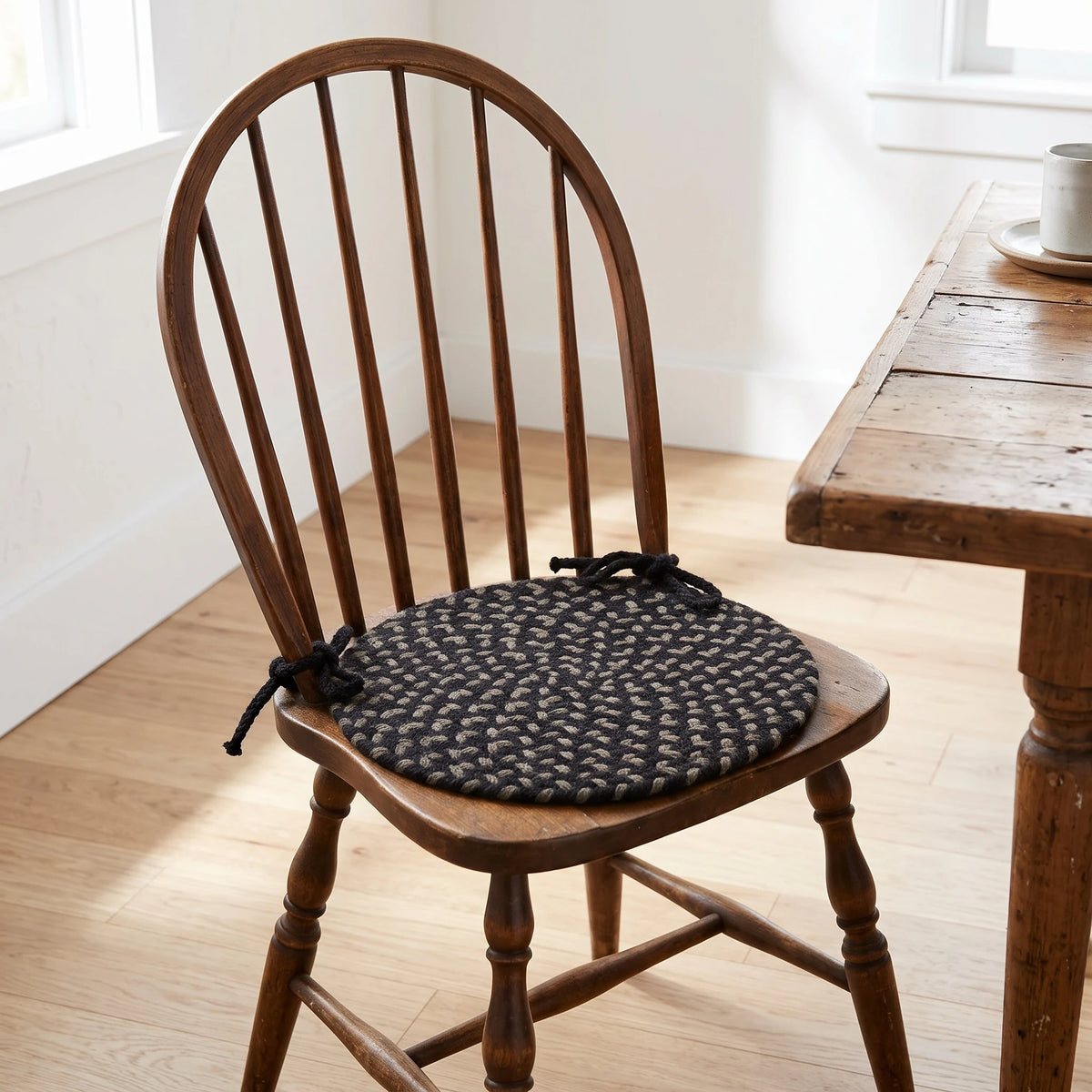 Homespun Braided Chair Pad - Black Satin - tied on a wooden Windsor dining chair