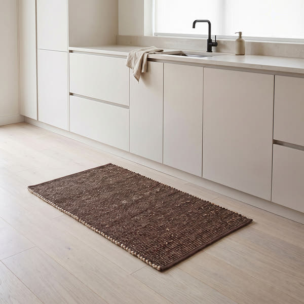 Terra brown jute and cotton runner rug, 2' x 4', in a kitchen