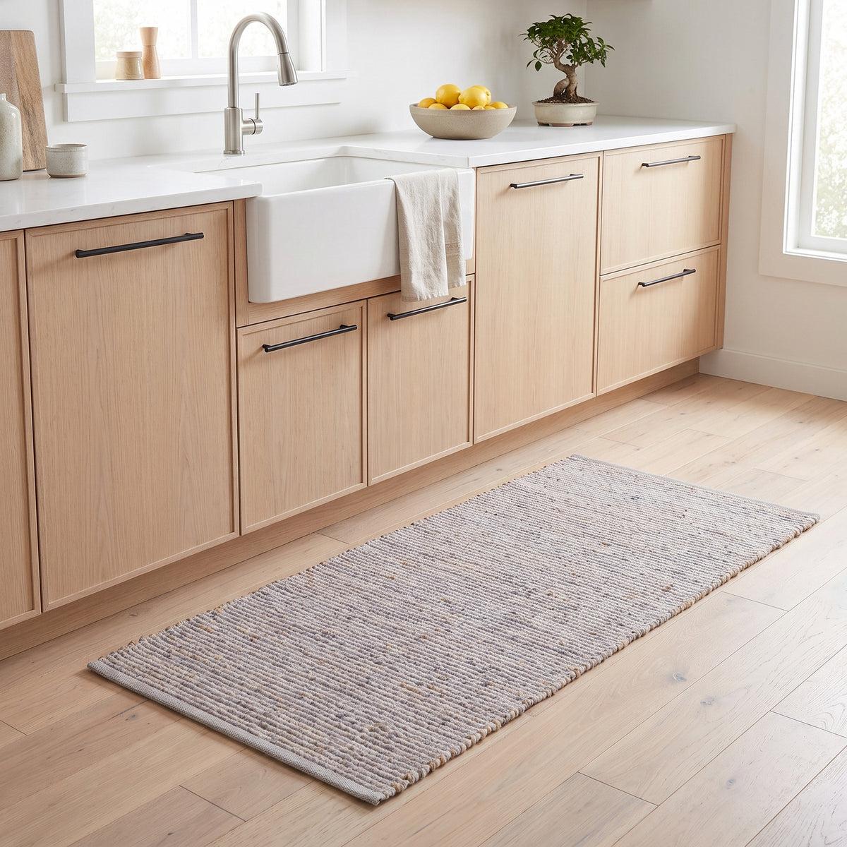 Terra light gray jute and cotton runner rug, 2' x 4', in a kitchen