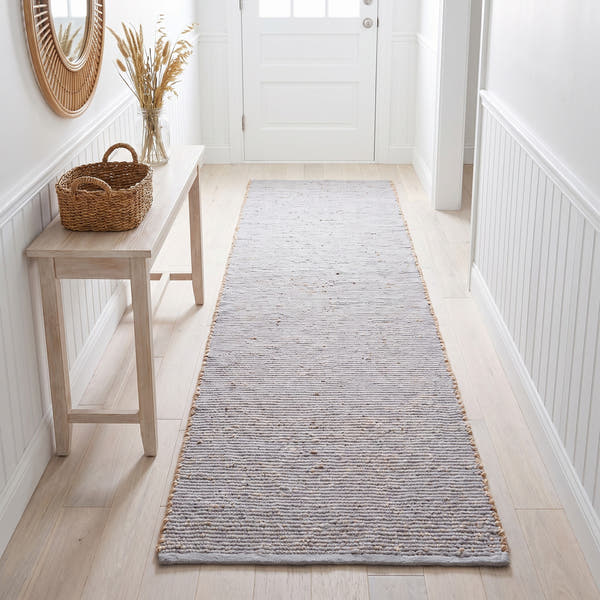 Terra light gray jute and cotton runner rug, 2' x 6', in a hallway