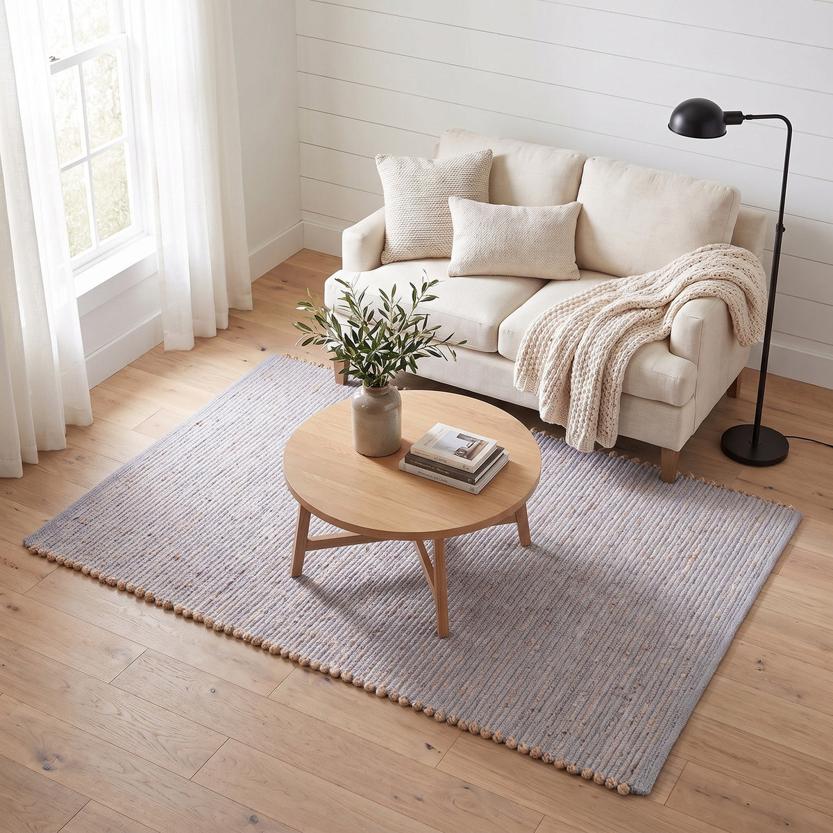 Terra light gray jute and cotton rug, 4' x 6', in a living room