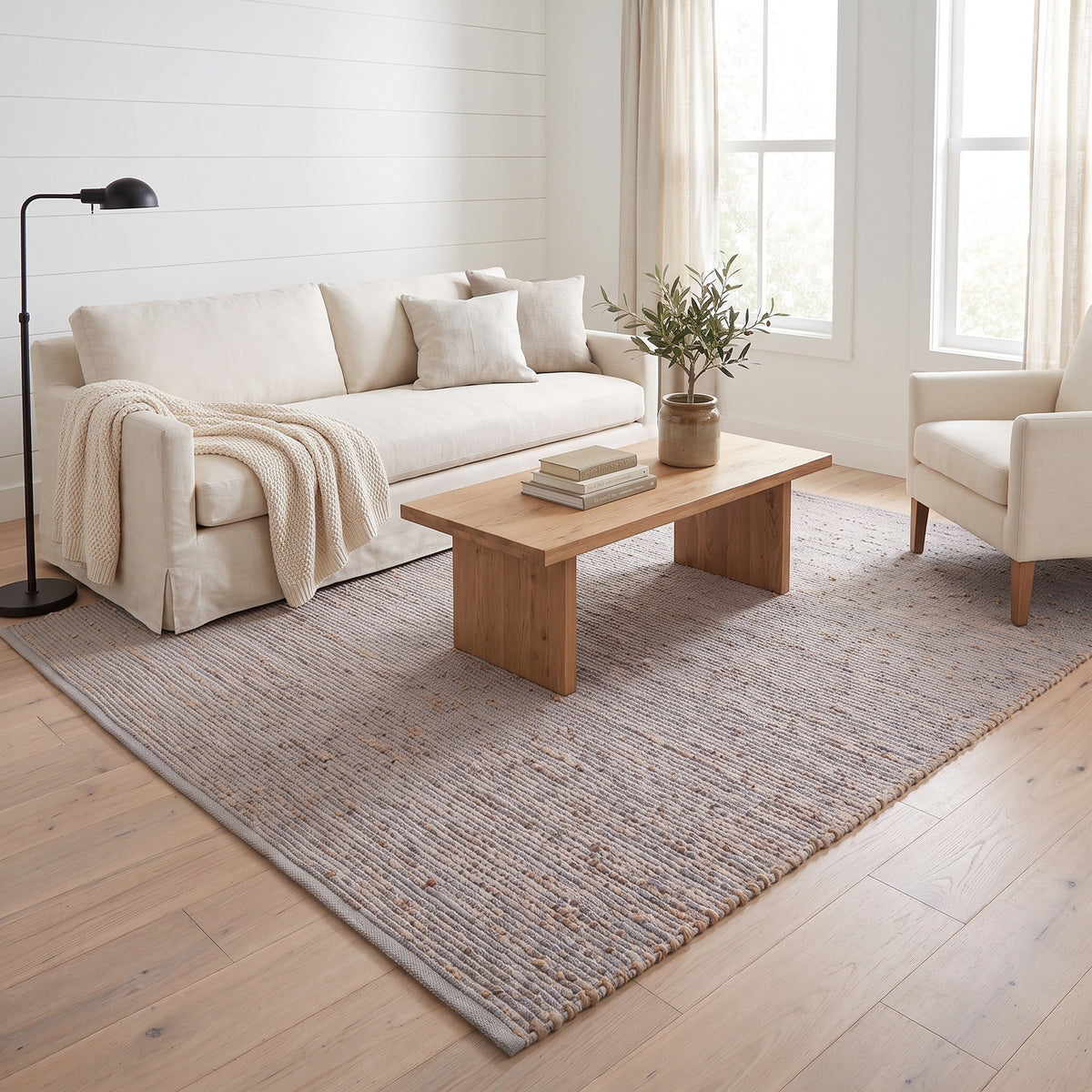 Terra light gray jute and cotton rug, 6' x 9', in a living room