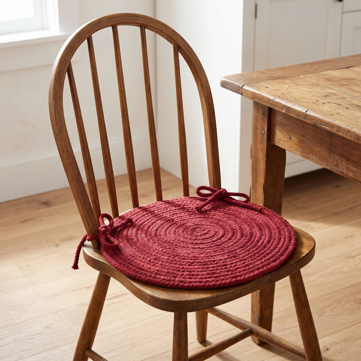 Maui Braided Chair Pad - Colonial Red - tied on a wooden Windsor dining chair