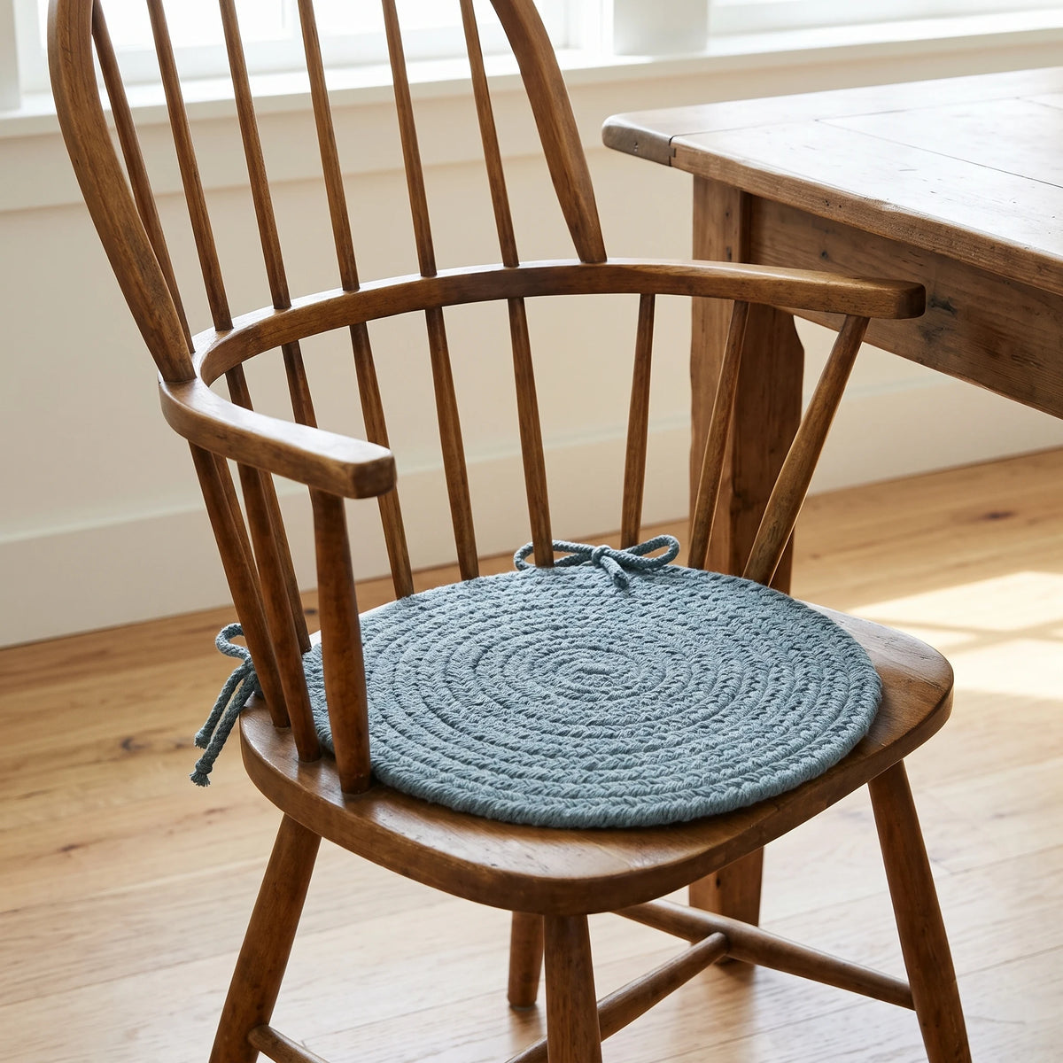 Maui Braided Chair Pad - Ocean Blue - tied on a wooden Windsor dining chair