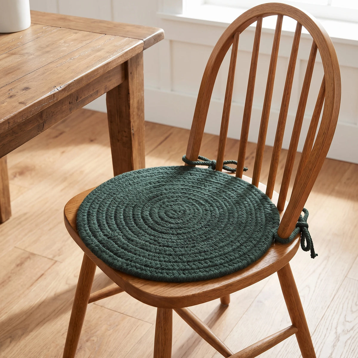 Maui Braided Chair Pad - Spruce Green - tied on a wooden Windsor dining chair