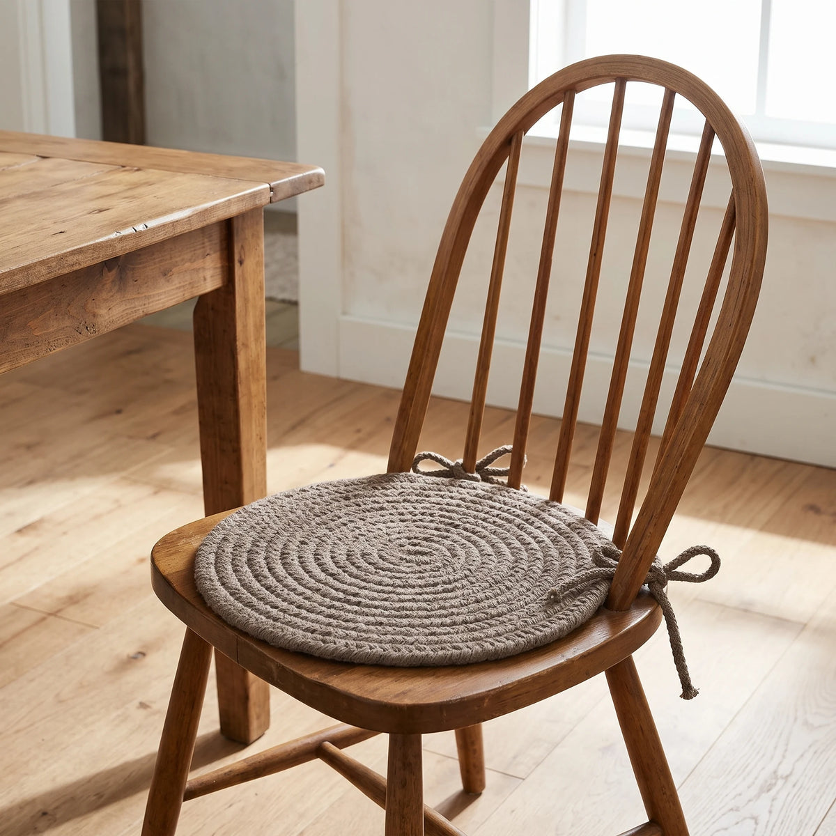 Maui Braided Chair Pad - Moonstone Brown - tied on a wooden Windsor dining chair