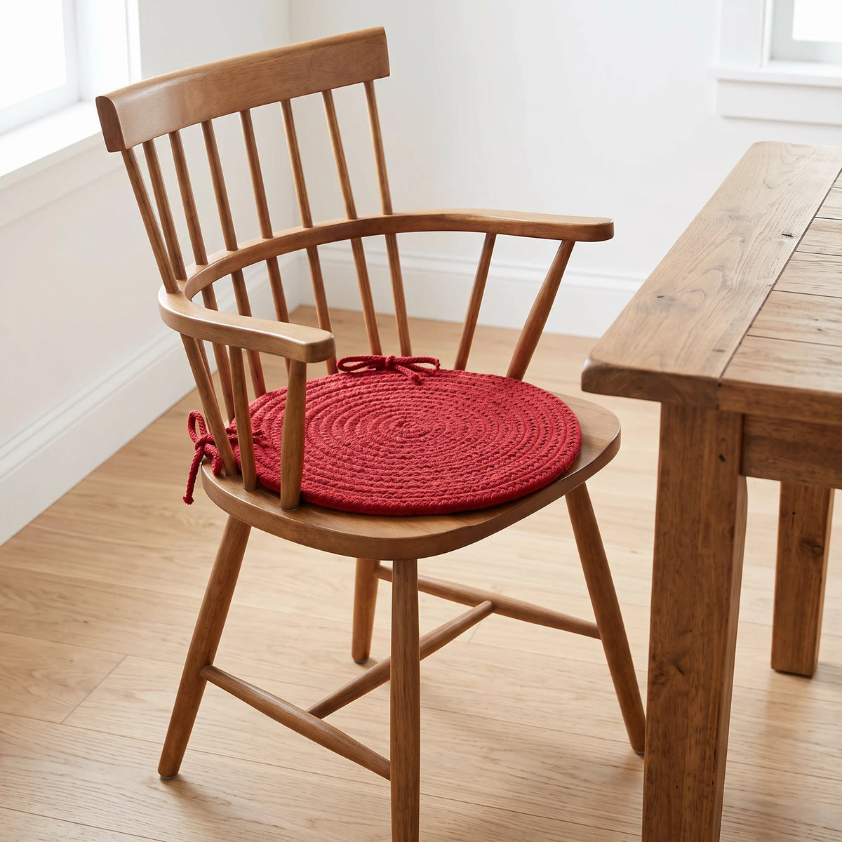 Maui Braided Chair Pad - Brilliant Red - tied on a wooden Windsor dining chair