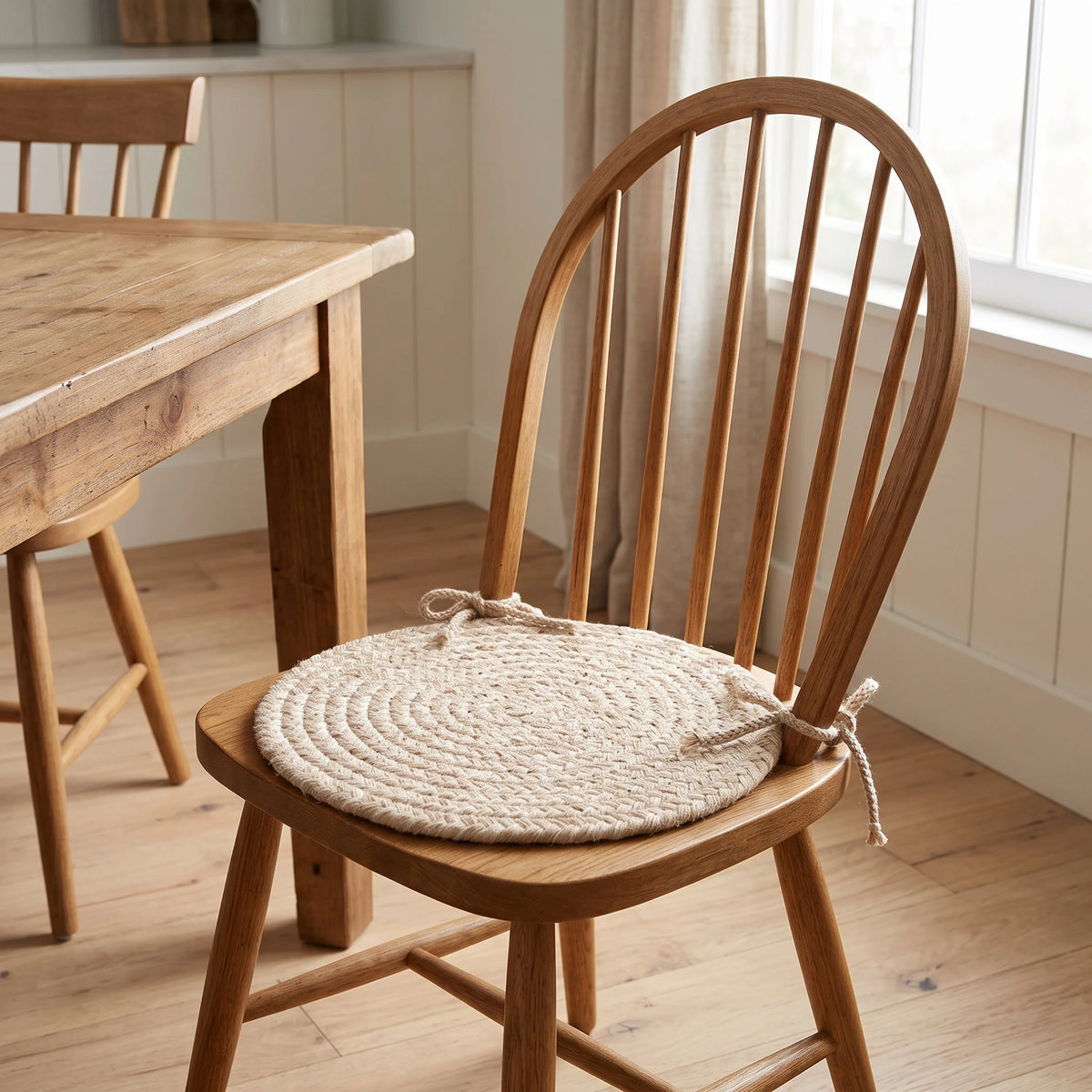 Pura Braided Chair Pad - Sand - tied on a wooden Windsor dining chair