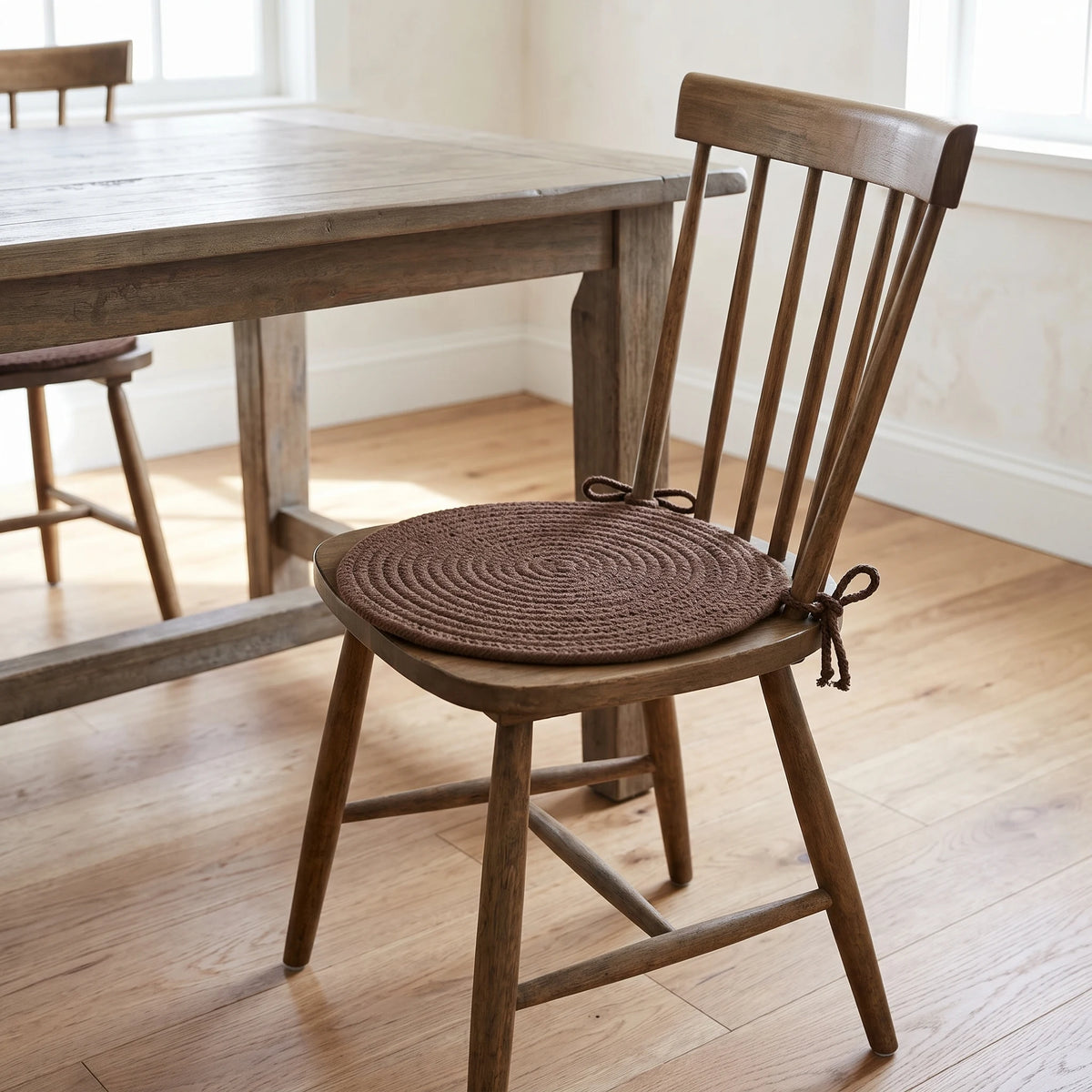 Pura Braided Chair Pad - Walnut - tied on a wooden Windsor dining chair
