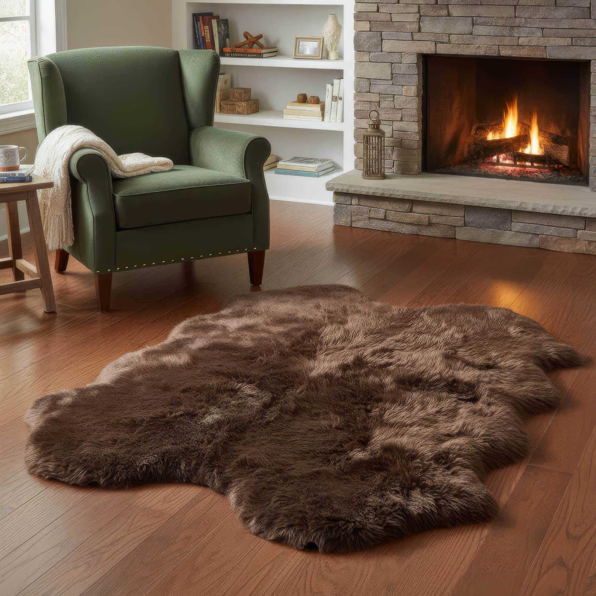 Brown fur rug on a wooden floor in front of a fireplace with a green armchair. #size_4' x 6'