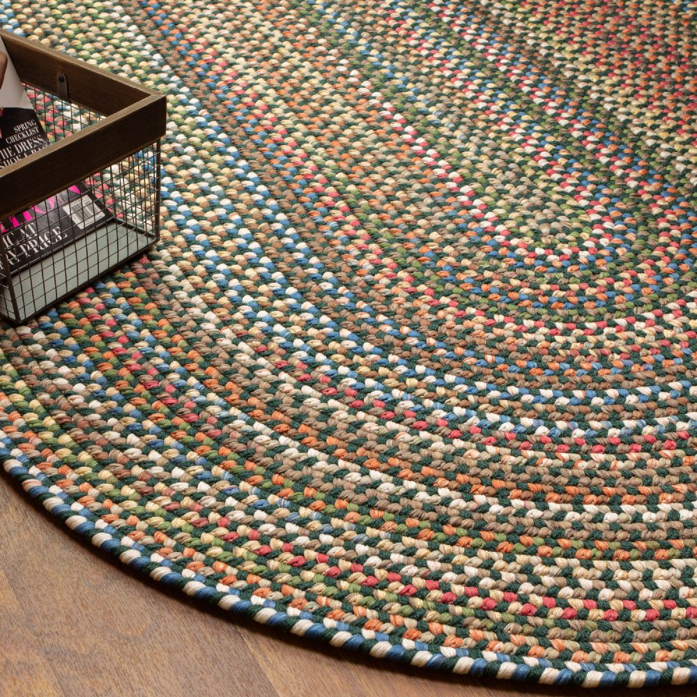 Roxbury Spruce Green braided rug styled in a room setting